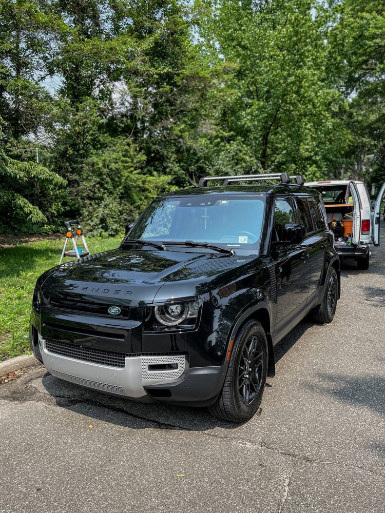 Black Land Rover Defender after an exterior detail