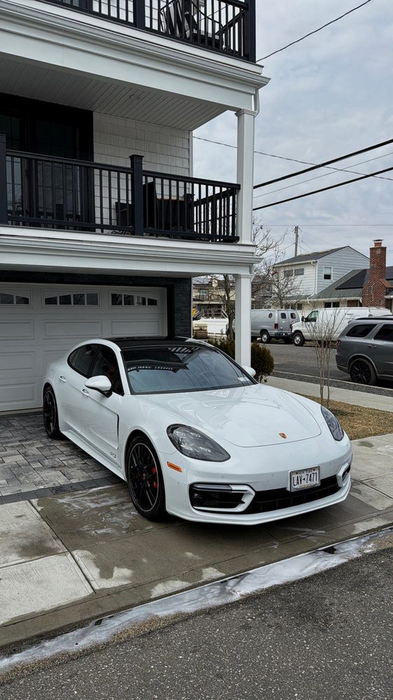 White Porsche Panamera parked after detailing