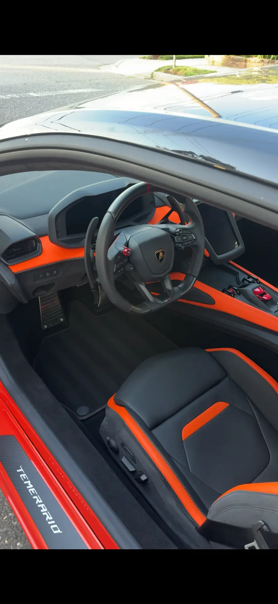 Lamborghini Temerario interior with orange and black leather cleaned