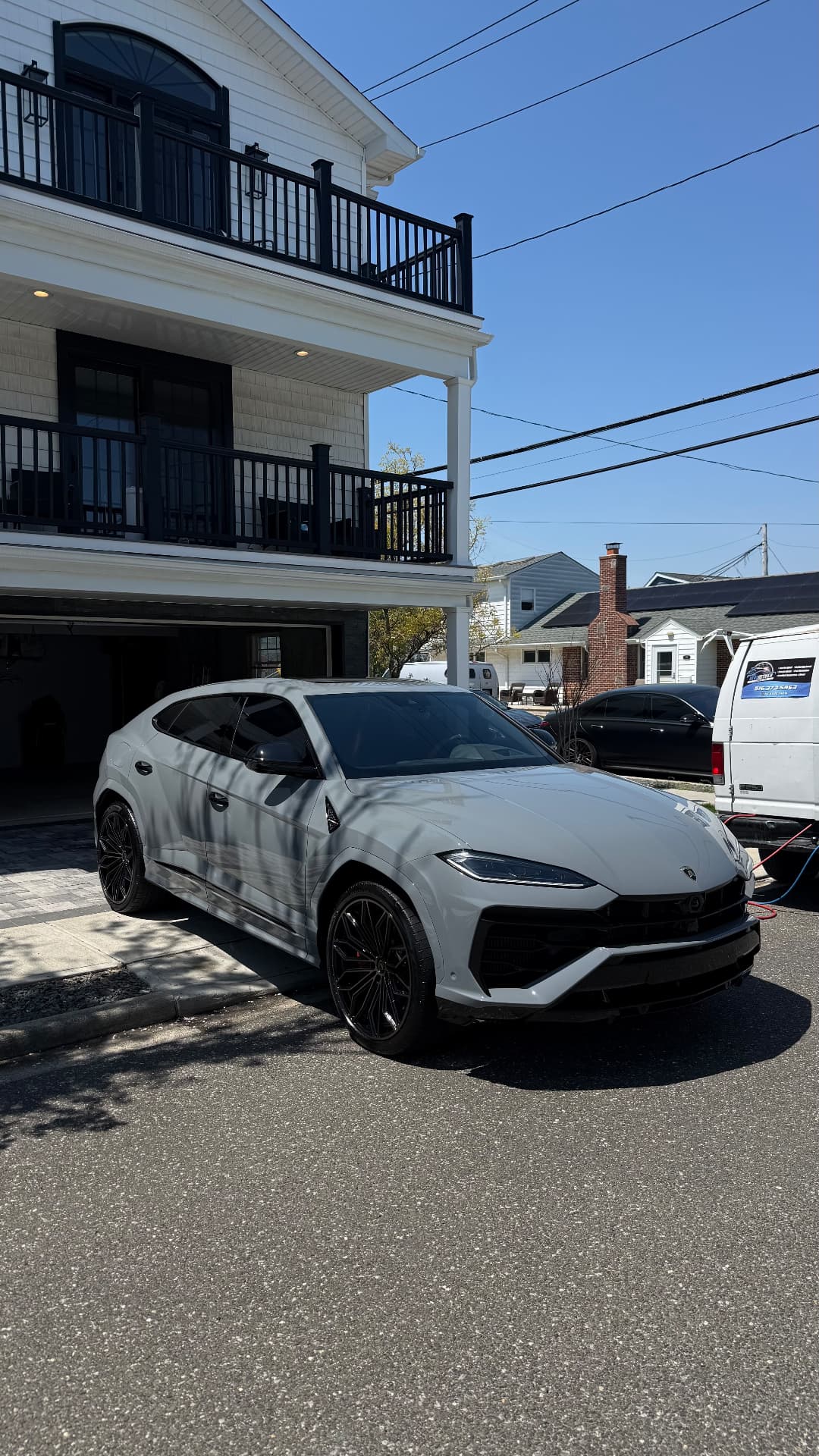 Grey Lamborghini Urus detailed outside a Long Island home