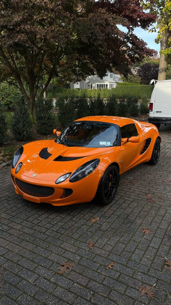 Orange Lotus Elise freshly detailed
